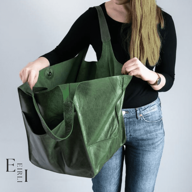 <img src="green-handbag.jpg" alt=" A beautiful green handbag carried by a woman official website www.eirlistore.com">