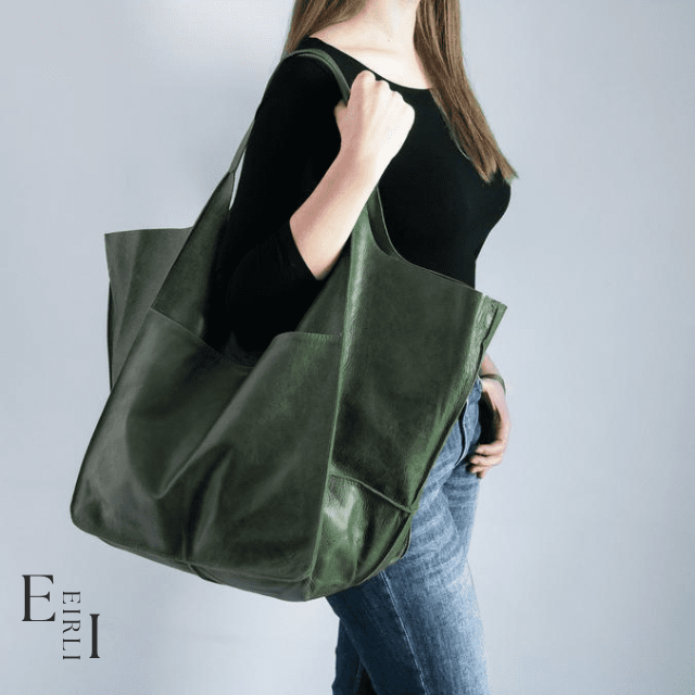 <img src="green-handbag.jpg" alt=" A beautiful green handbag carried by a woman official website www.eirlistore.com">