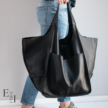 <img src="black-handbag.jpg" alt=" A beautiful black handbag carried by a woman official website www.eirlistore.com">