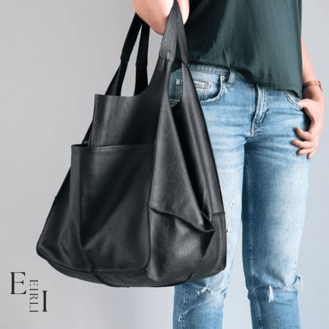 <img src="black-handbag.jpg" alt=" A beautiful black handbag carried by a woman official website www.eirlistore.com">